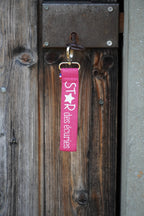 Porte clé sangle rose